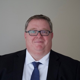 A photograph of a man.